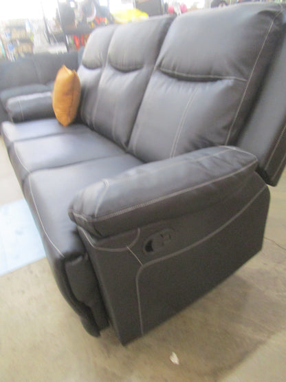 Black flaux leather sofa with cup holder.