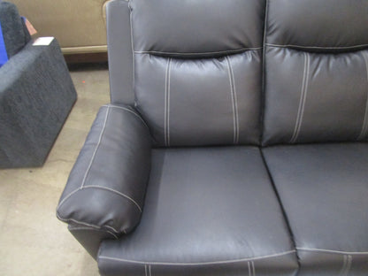 Black flaux leather sofa with cup holder.